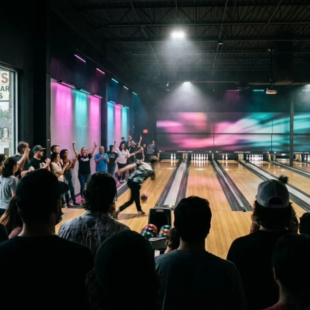 Crowd silhouettes inside a lively Georgetown indoor venue on a rainy day, a top rainy day activity in Georgetown, TX