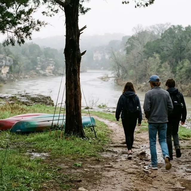 Teens walking toward the San Gabriel River with kayaks and fishing rods, teen friendly activities Georgetown TX
